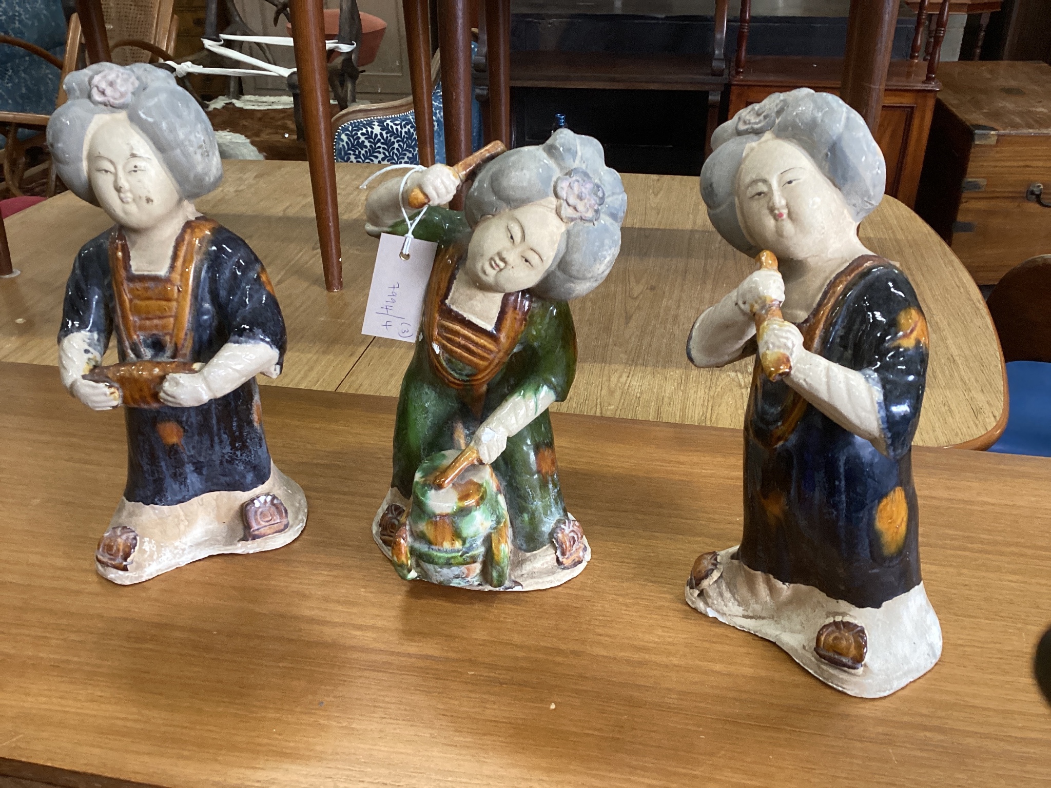 Three Chinese glazed pottery figures of musicians largest height 34cms.